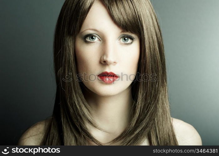 The young sexy girl in chestnut-coloured wig