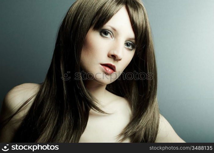 The young sexy girl in chestnut-coloured wig