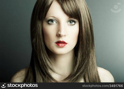 The young sexy girl in chestnut-coloured wig