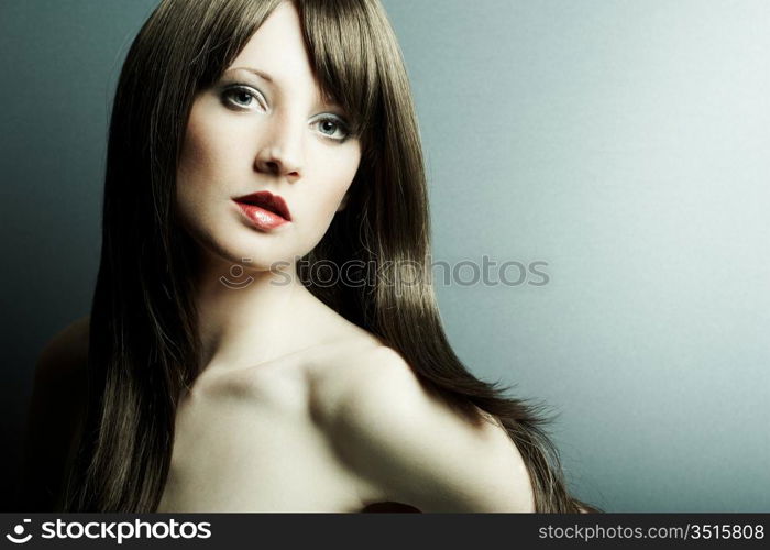 The young sexy girl in chestnut-coloured wig