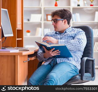 The young student at computer table. Young student at computer table