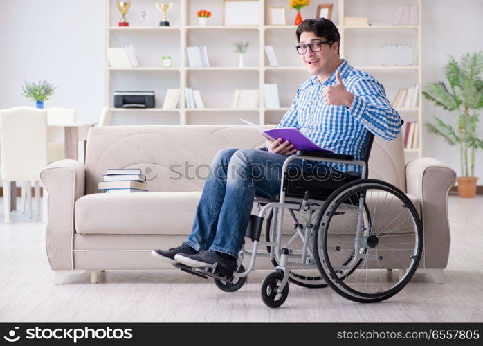 The young student on wheelchair in disability concept. Young student on wheelchair in disability concept