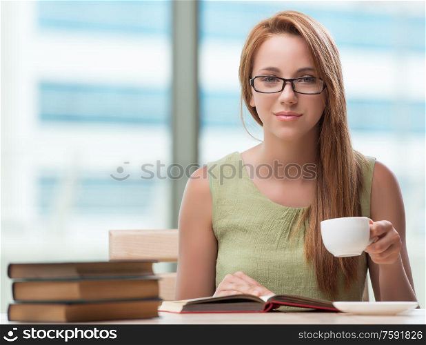 The young student preparing for exams drinking tea. Young student preparing for exams drinking tea