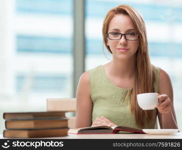 The young student preparing for exams drinking tea. Young student preparing for exams drinking tea