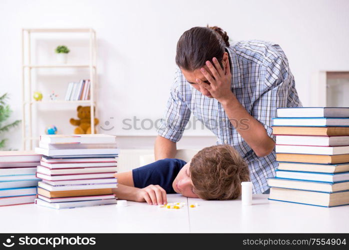 The young student stressed due to excessive studies. Young student stressed due to excessive studies