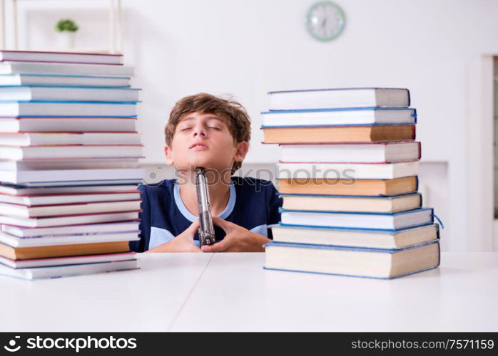 The young student stressed due to excessive studies. Young student stressed due to excessive studies