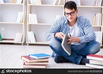 The young student studying with books. Young student studying with books