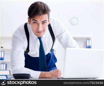 The young stylish businessman working in the office. Young stylish businessman working in the office