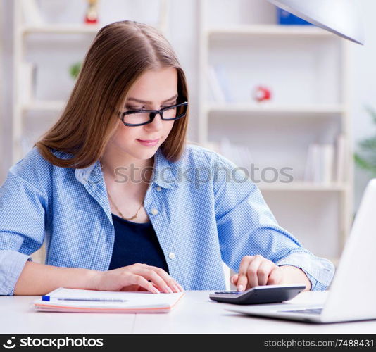 The young teenage female student preparing for exams at home. Young teenage female student preparing for exams at home