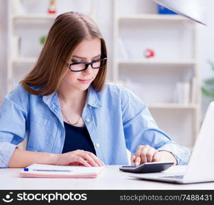 The young teenage female student preparing for exams at home. Young teenage female student preparing for exams at home