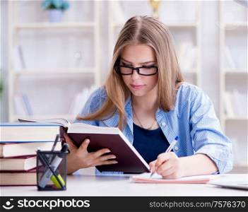 The young teenage female student preparing for exams at home. Young teenage female student preparing for exams at home