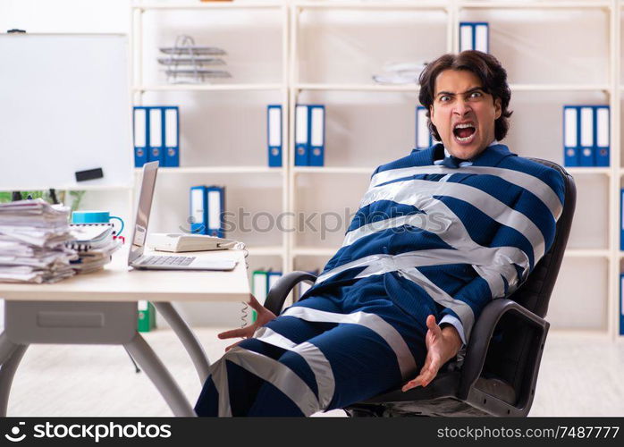 The young tied male employee in the office. Young tied male employee in the office