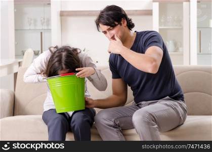 The young wife suffering from sick stomach and vomiting. Young wife suffering from sick stomach and vomiting