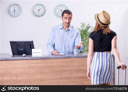 The young woman at hotel reception. Young woman at hotel reception