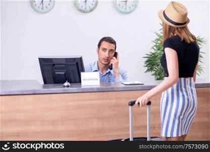 The young woman at hotel reception. Young woman at hotel reception