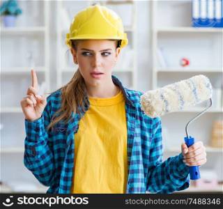 The young woman doing painting at home. Young woman doing painting at home