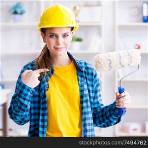 The young woman doing painting at home. Young woman doing painting at home