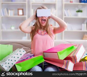 The young woman doing shopping with virtual reality glasses. Young woman doing shopping with virtual reality glasses