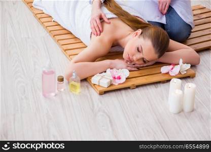 The young woman during spa procedure in salon. Young woman during spa procedure in salon