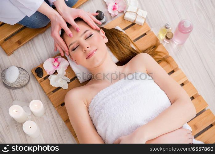 The young woman during spa procedure in salon. Young woman during spa procedure in salon
