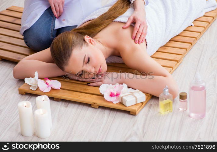 The young woman during spa procedure in salon. Young woman during spa procedure in salon