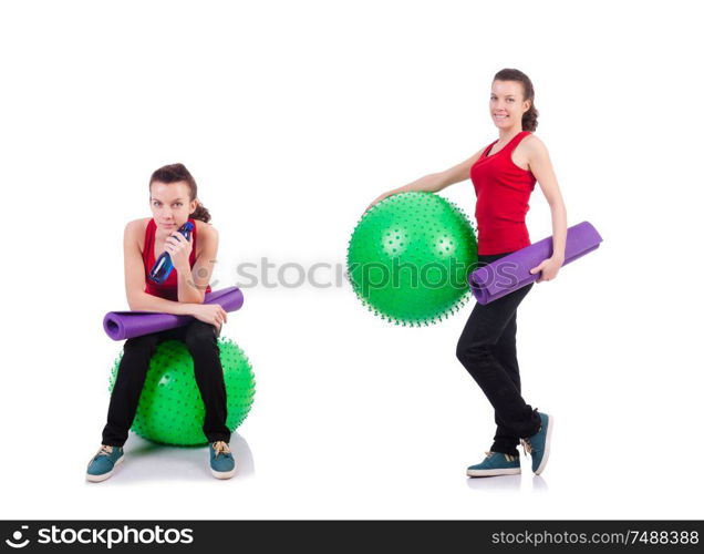 The young woman exercising with swiss ball. Young woman exercising with swiss ball