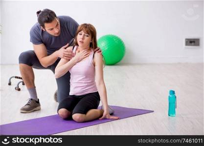 The young woman feeling bad during training in first aid concept. Young woman feeling bad during training in first aid concept
