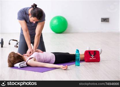 The young woman feeling bad during training in first aid concept. Young woman feeling bad during training in first aid concept