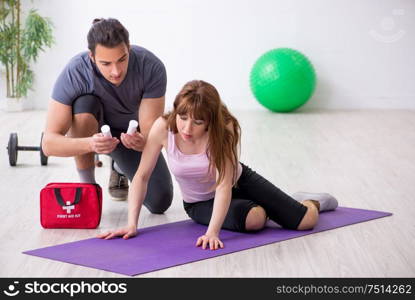 The young woman feeling bad during training in first aid concept. Young woman feeling bad during training in first aid concept