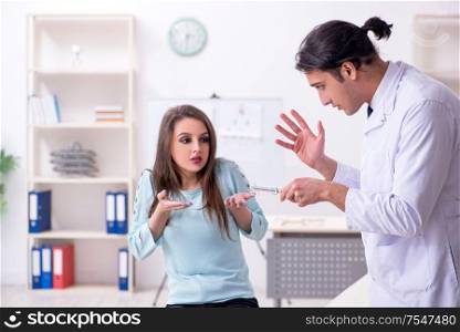 The young woman visiting male doctor oculist. Young woman visiting male doctor oculist