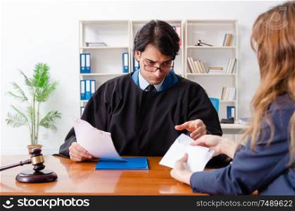 The young woman visiting male lawyer . Young woman visiting male lawyer