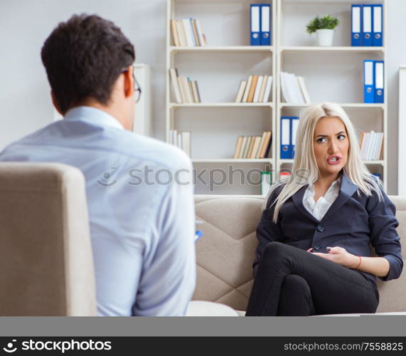 The young woman visiting psychiatrist man doctor for consultation. Young woman visiting psychiatrist man doctor for consultation