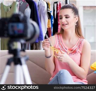 The young woman working as fashion blogger vlogger. Young woman working as fashion blogger vlogger