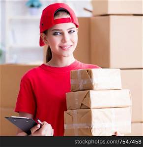 The young woman working in parcel distribution center. Young woman working in parcel distribution center