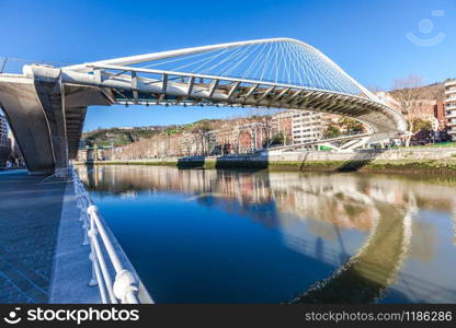 The Zubizuri, the Campo Volantin Footbridge in Bilbao, Spain, modern pedestrian tied arch crossing of the Nervion River by Santiago Calatrava architect