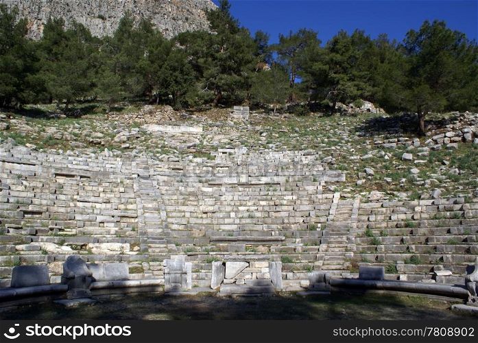 Theater, shadow and pine trees in Priene, Turkey