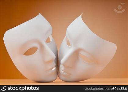 Theatre concept with masks against background