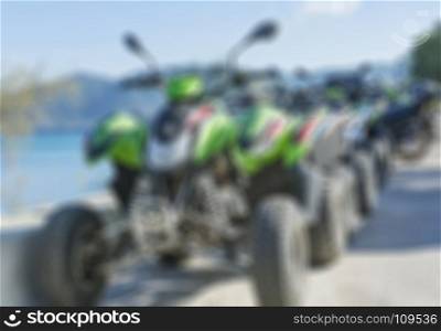 Thematic blurred background. Parking for ATVs