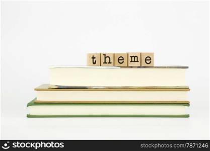 theme word on wood stamps stack on books