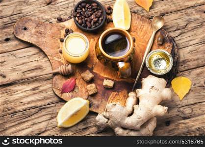 therapeutic tea with ginger. cup with therapeutic tea from the root of ginger, honey and lemon
