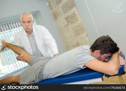 therapist doing a leg massage