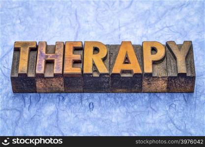 therapy - word abstract in vintage letterpress wood type