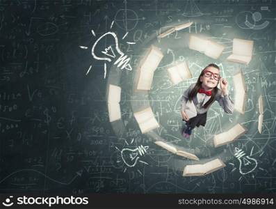 There is great idea in my mind. Wideangle picture of funny schoolgirl with paper plane in hand