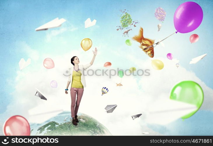 There is no limits for your imagination. Young woman in casual in surreal positive reality