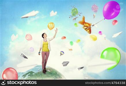 There is no limits for your imagination. Young woman in casual in surreal positive reality