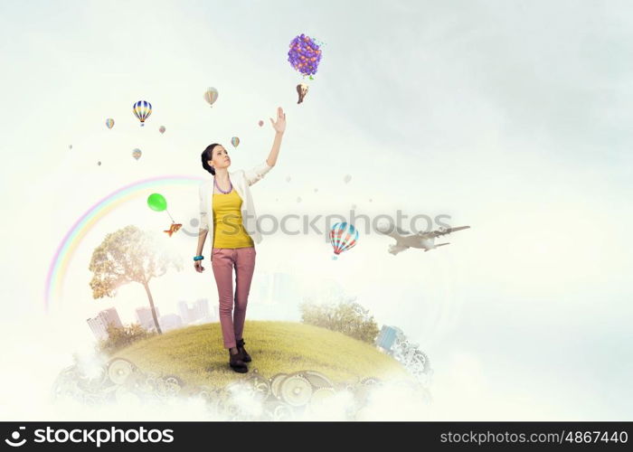 There is no limits for your imagination. Young woman in casual in surreal positive reality