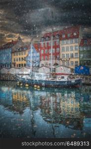 there is snow in the winter. Nyhavn is the old harbor of Copenhagen. Denmark. Nyhavn is the old harbor of Copenhagen