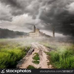 Thermal station and country road under storm clouds