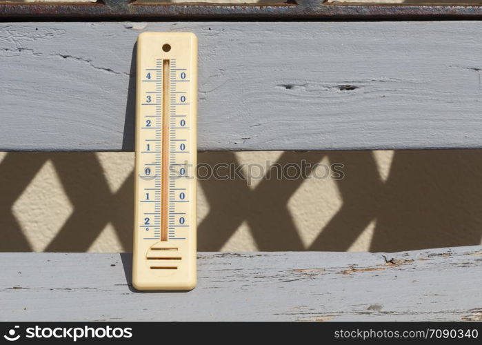 Thermometer on a bench in a garden