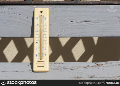 Thermometer on a bench in a garden